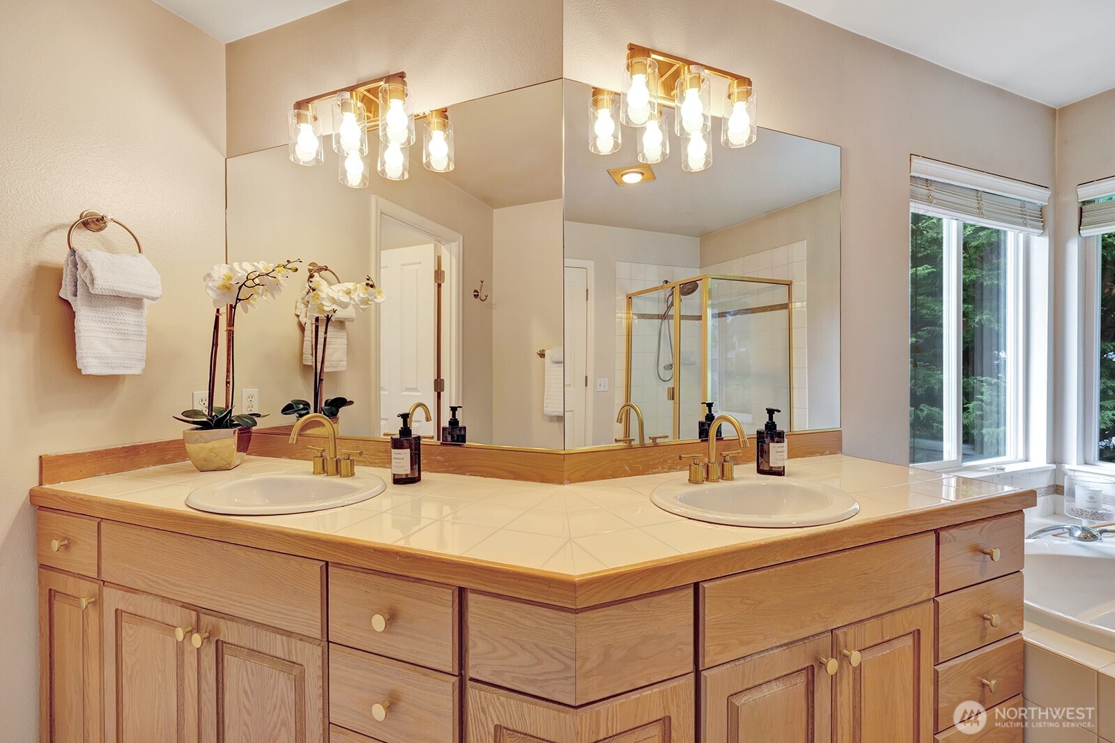 3208 175th Street Southeast Bothell, WA 98012 - Photo 23 of 34 a bathroom with double vanity sinks and a mirror