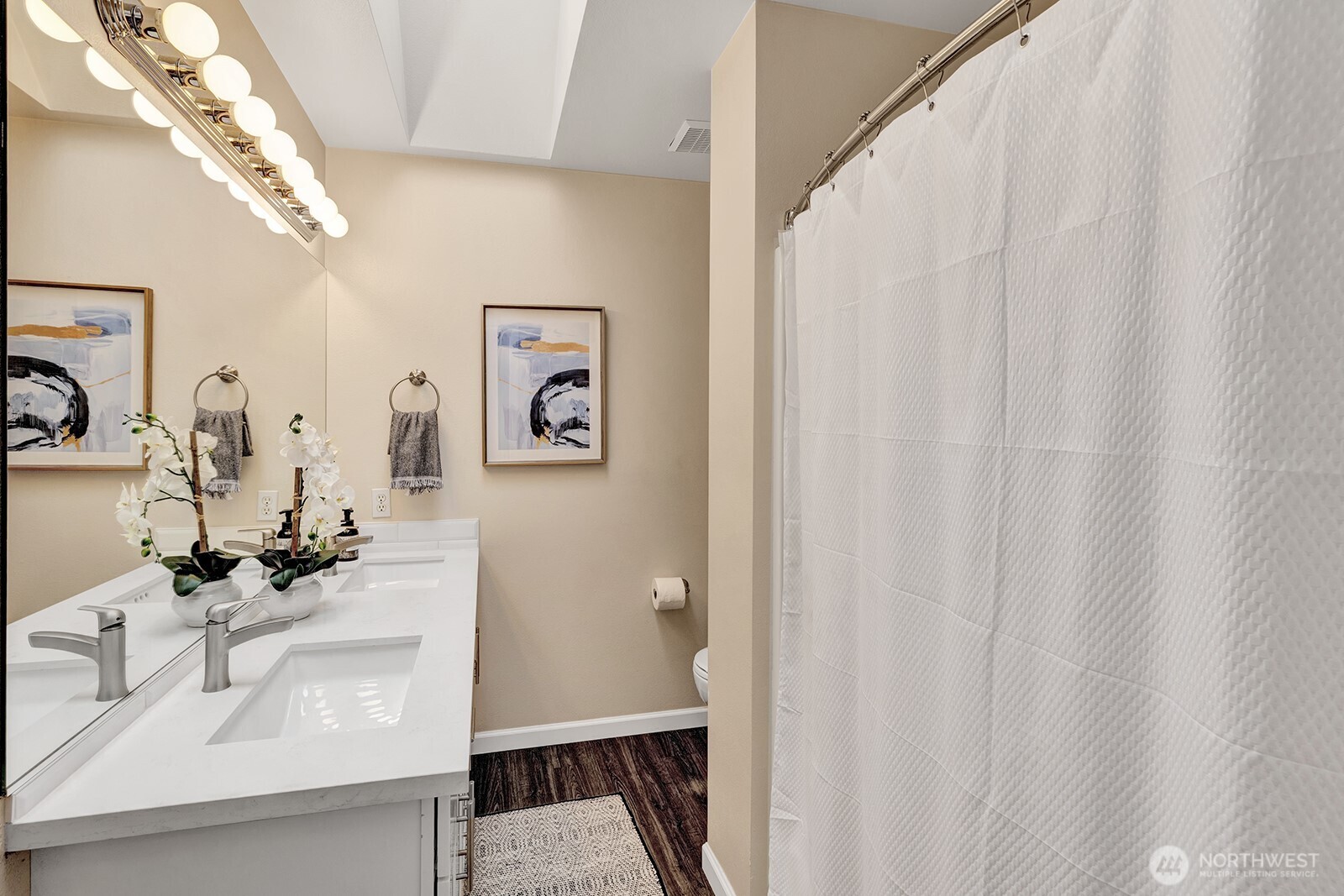 3208 175th Street Southeast Bothell, WA 98012 - Photo 27 of 34 a bathroom with a sink and a mirror