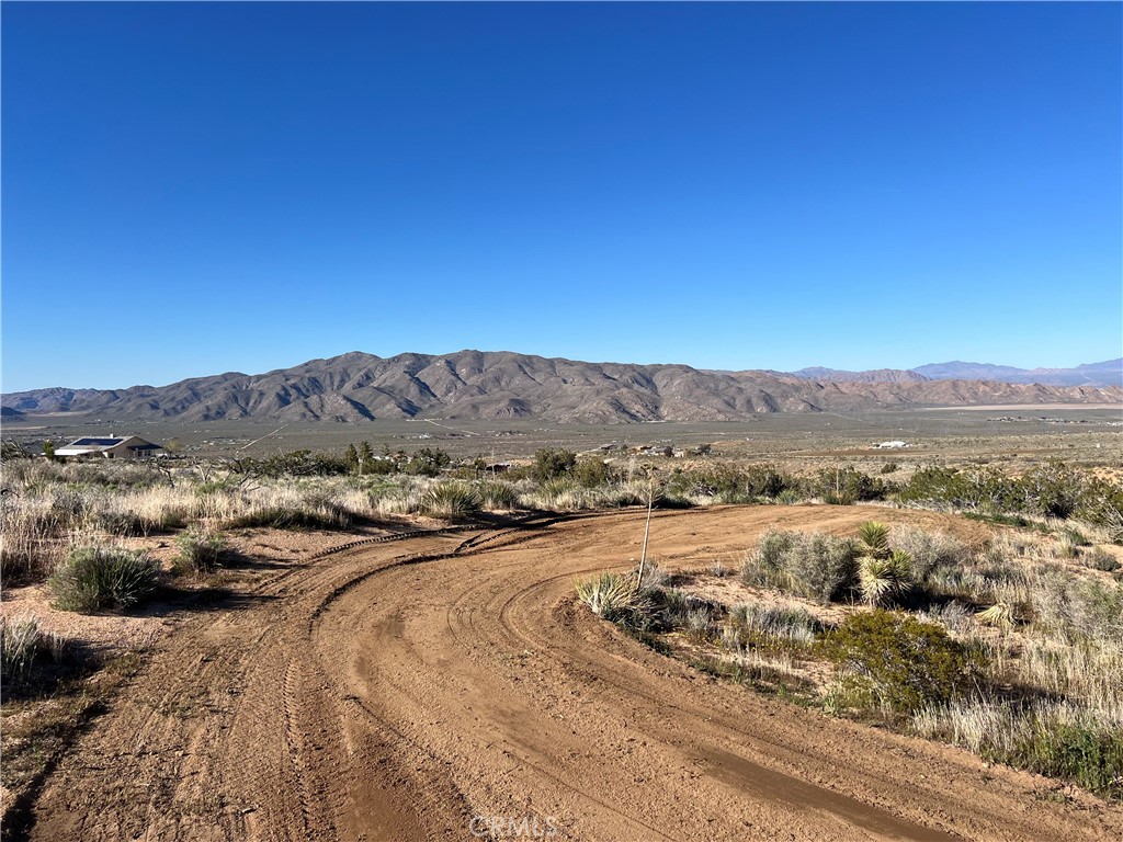 0 Valley View Road Apple Valley, CA 92308 - Photo 15 of 15 a view of a dry yard with mountains
