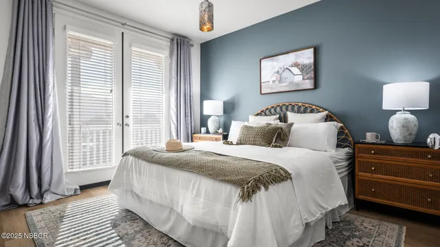 a bedroom with bed and a window