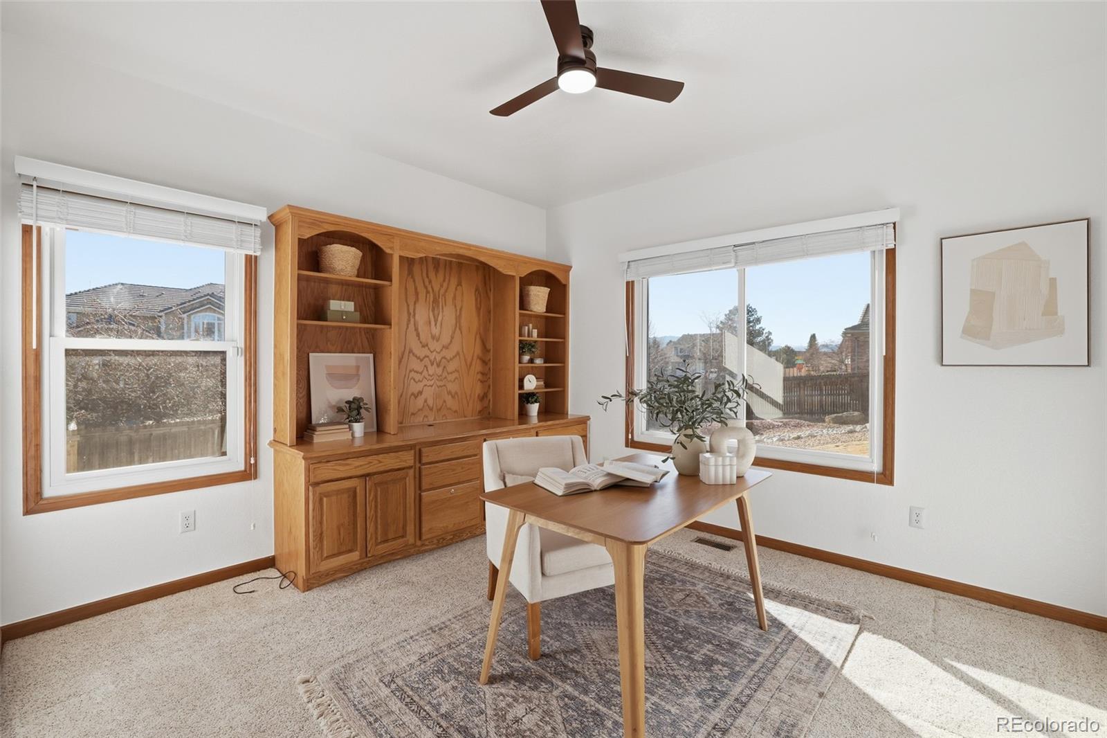 10917 Ammons Street Broomfield, CO 80021 - Photo 18 of 47 a dining room with furniture and window