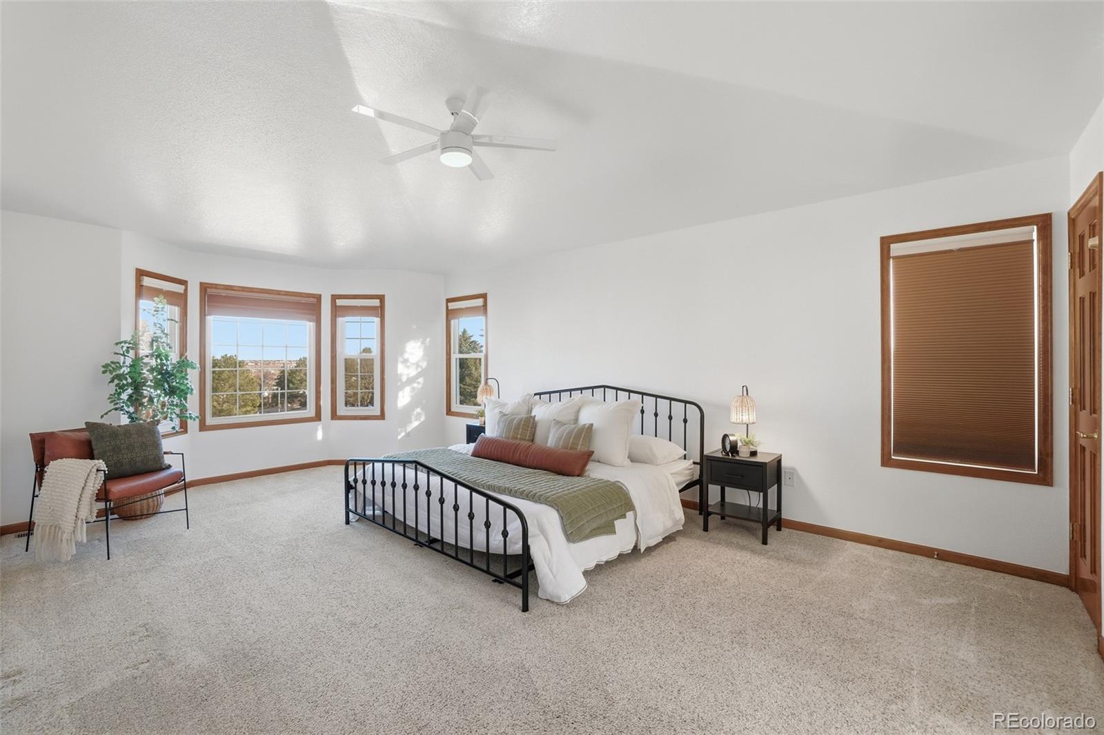 10917 Ammons Street Broomfield, CO 80021 - Photo 21 of 47 a bed room with furniture and a window