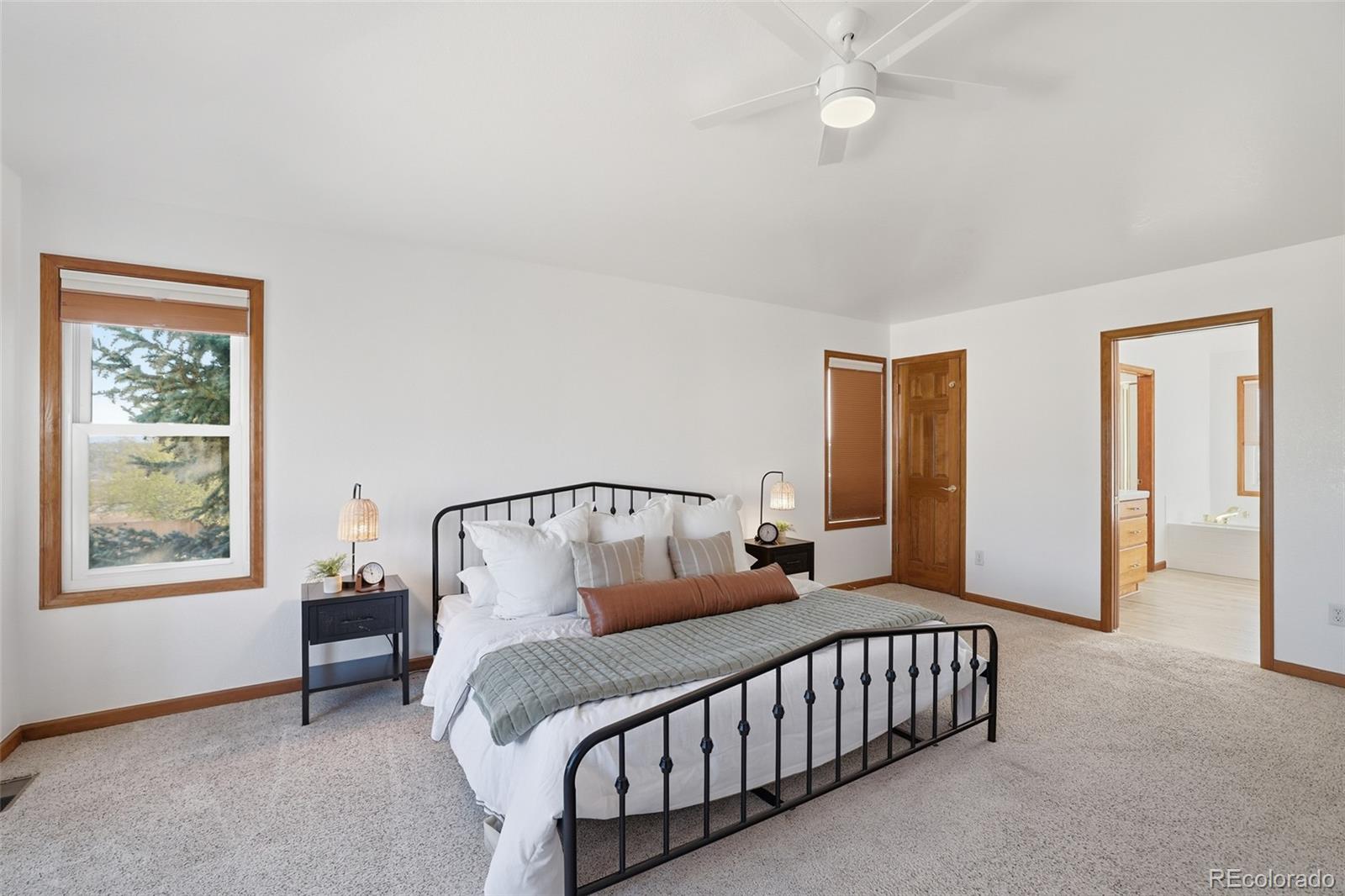 10917 Ammons Street Broomfield, CO 80021 - Photo 22 of 47 a bedroom with furniture and a window