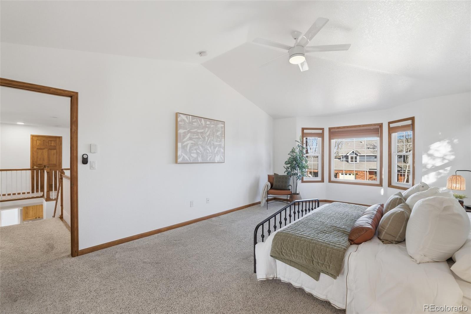 10917 Ammons Street Broomfield, CO 80021 - Photo 23 of 47 a bedroom with a bed and a large window