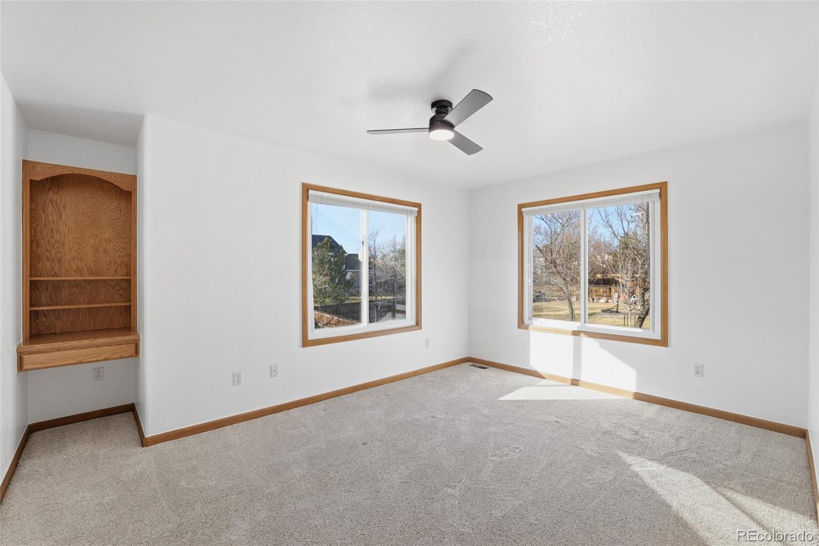 10917 Ammons Street Broomfield, CO 80021 - Photo 30 of 47 a view of an empty room with a window