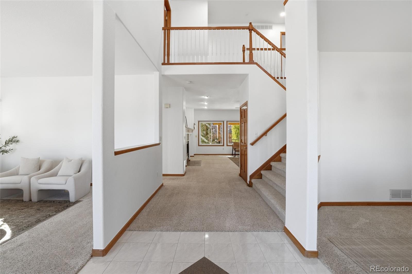 10917 Ammons Street Broomfield, CO 80021 - Photo 3 of 47 a view of staircase with white walls and stairs