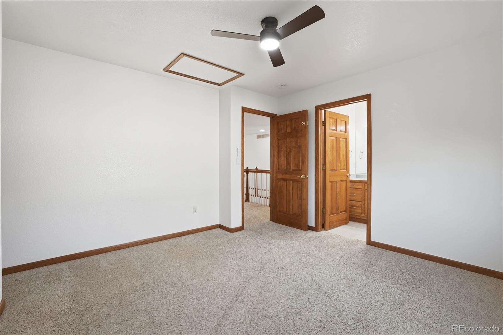 10917 Ammons Street Broomfield, CO 80021 - Photo 33 of 47 an empty room with closet and windows