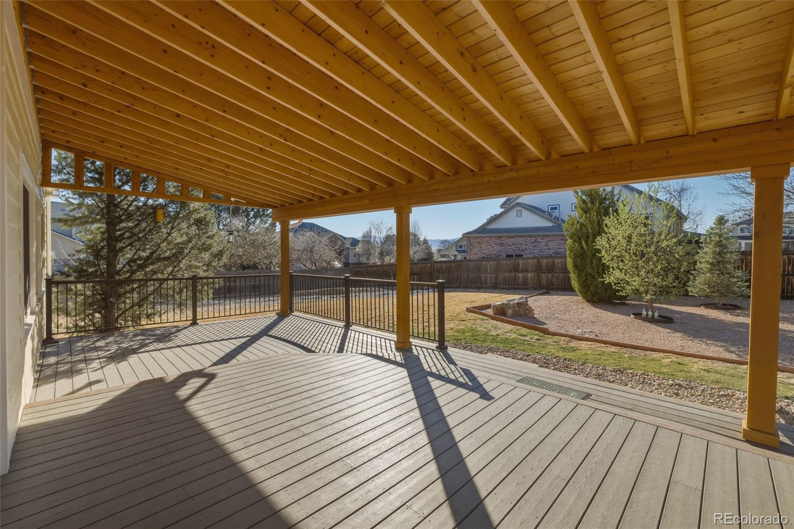 10917 Ammons Street Broomfield, CO 80021 - Photo 40 of 47 a view of a balcony with wooden floor