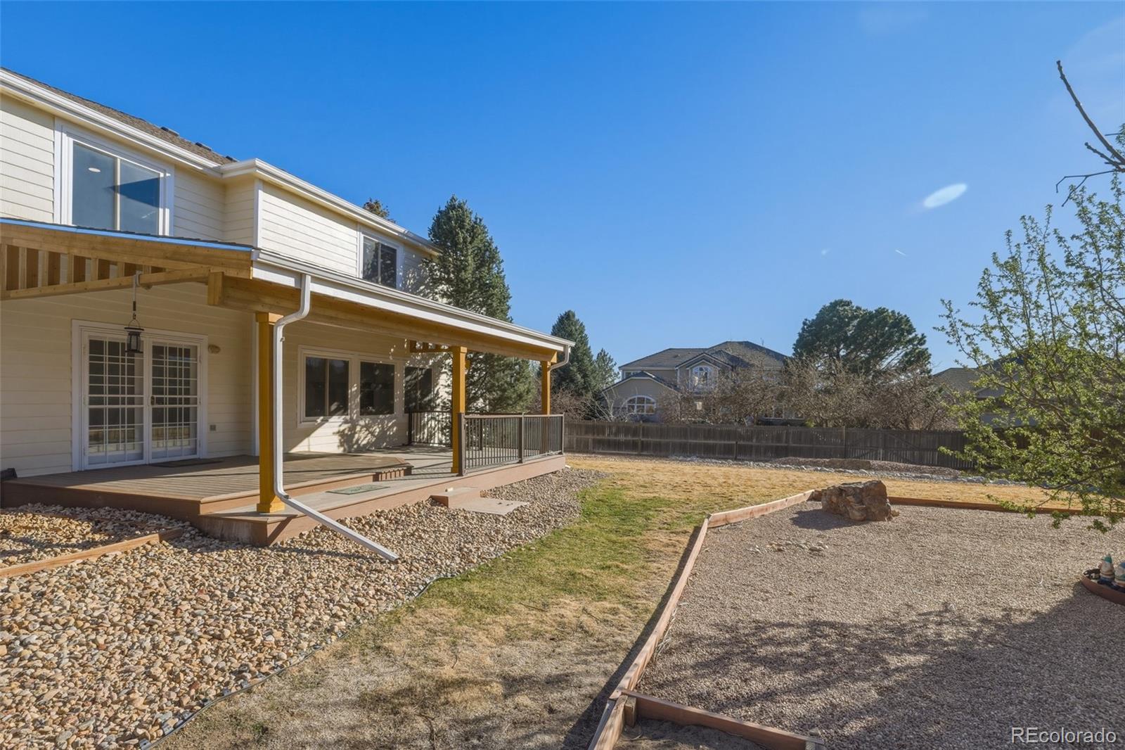 10917 Ammons Street Broomfield, CO 80021 - Photo 42 of 47 a front view of a house with a yard