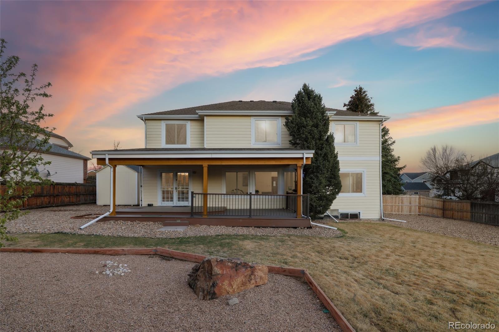 10917 Ammons Street Broomfield, CO 80021 - Photo 43 of 47 a front view of a house with a yard