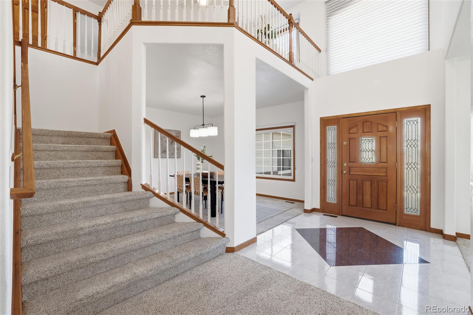 10917 Ammons Street Broomfield, CO 80021 - Photo 7 of 47 a view of staircase with white walls and door