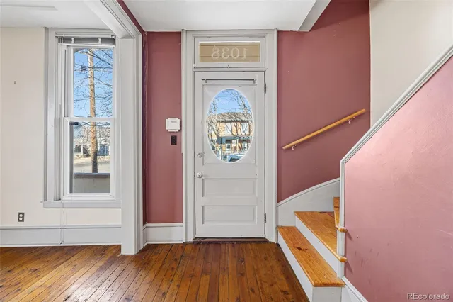 a view of front door with wooden floor
