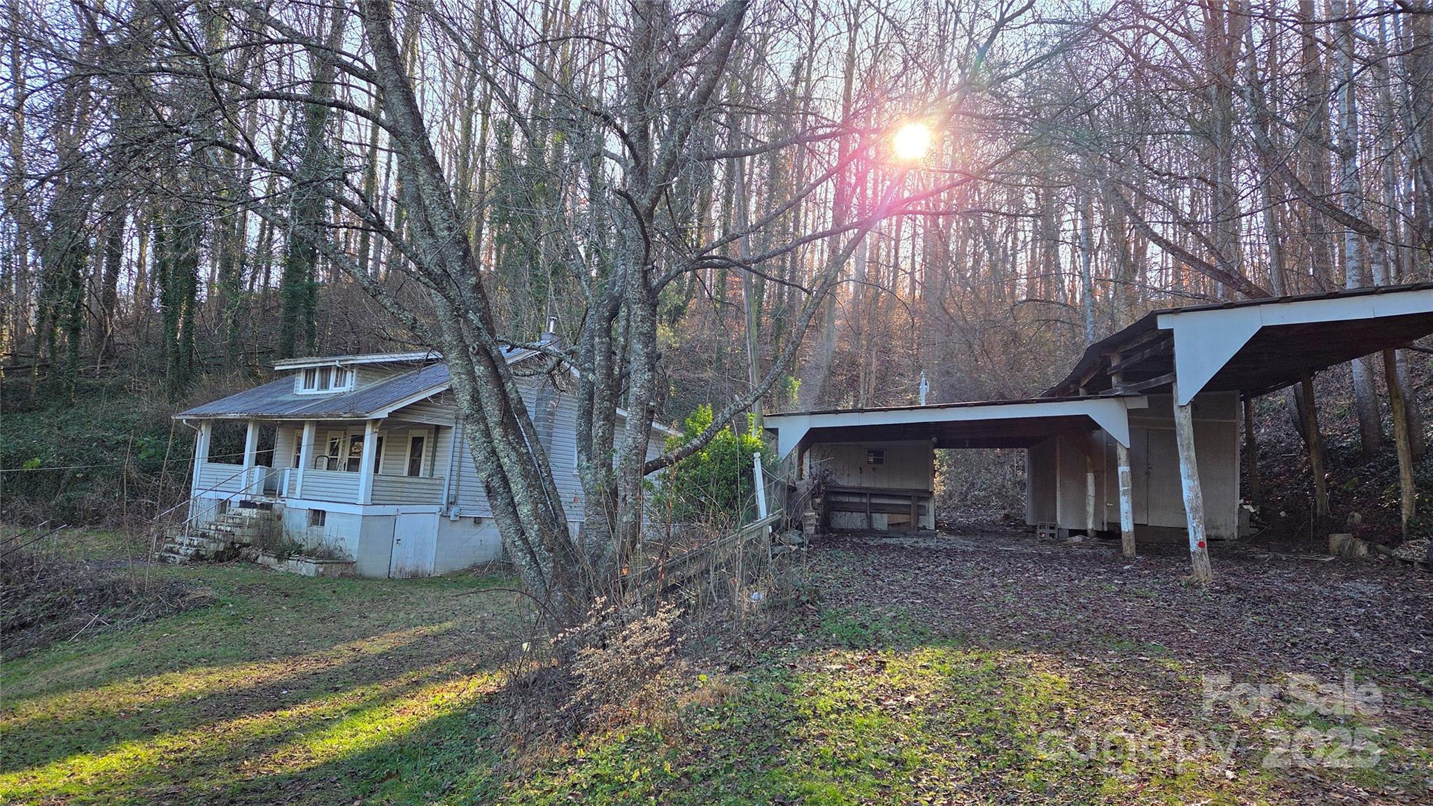 39 Henry Road Sylva, NC 28779 - Photo 2 of 20 a view of house with outdoor seating