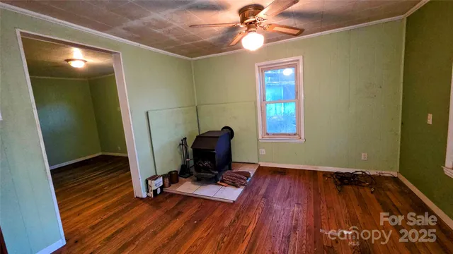 a view of a workspace with furniture and wooden floor