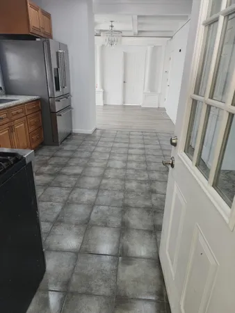 a bathroom with a granite countertop shower