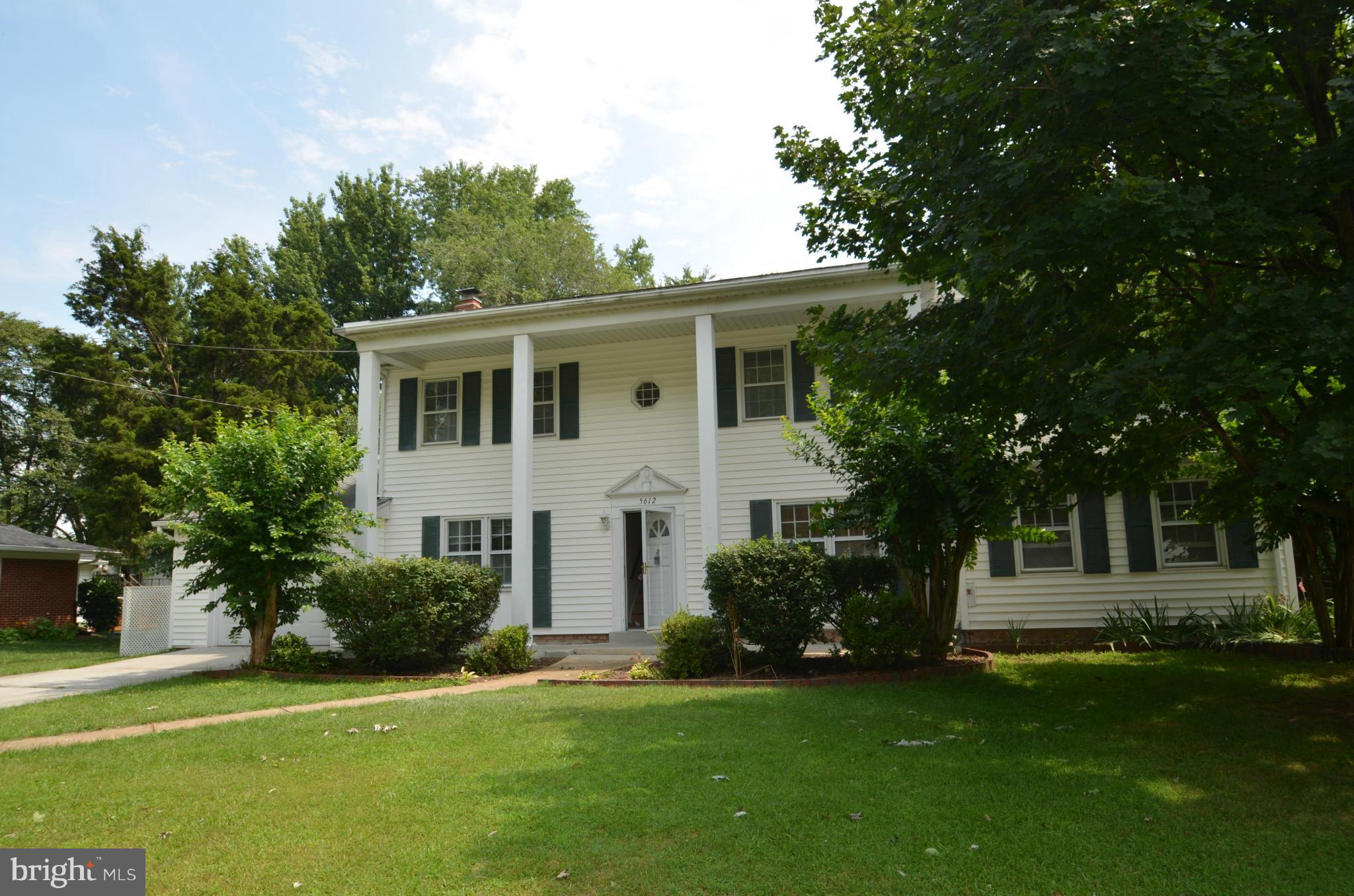5612 Ashfield Road Alexandria, VA 22315 - Photo 1 of 29 a front view of a house with a garden