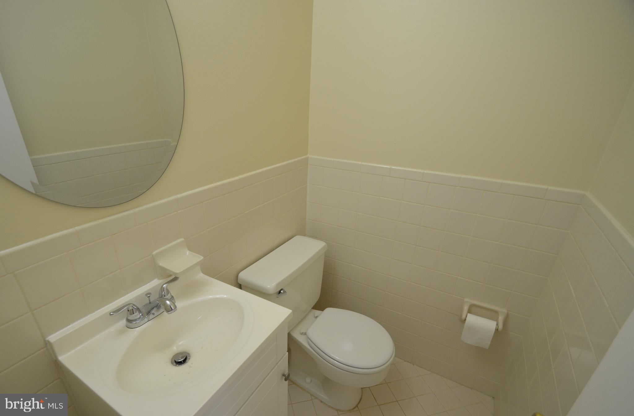 5612 Ashfield Road Alexandria, VA 22315 - Photo 12 of 29 a bathroom with a sink a toilet and shower