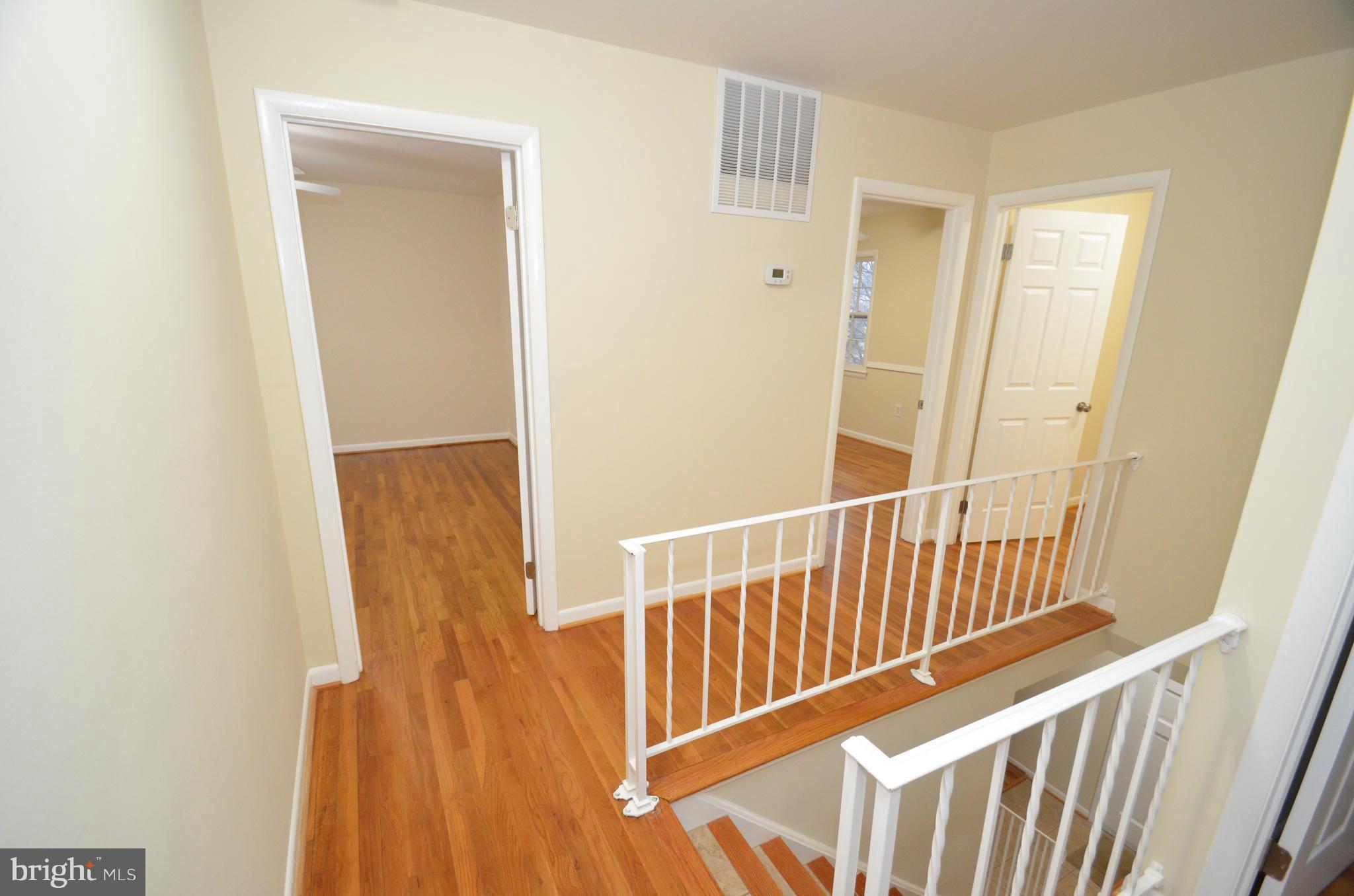 5612 Ashfield Road Alexandria, VA 22315 - Photo 16 of 29 a view of entryway with wooden floor