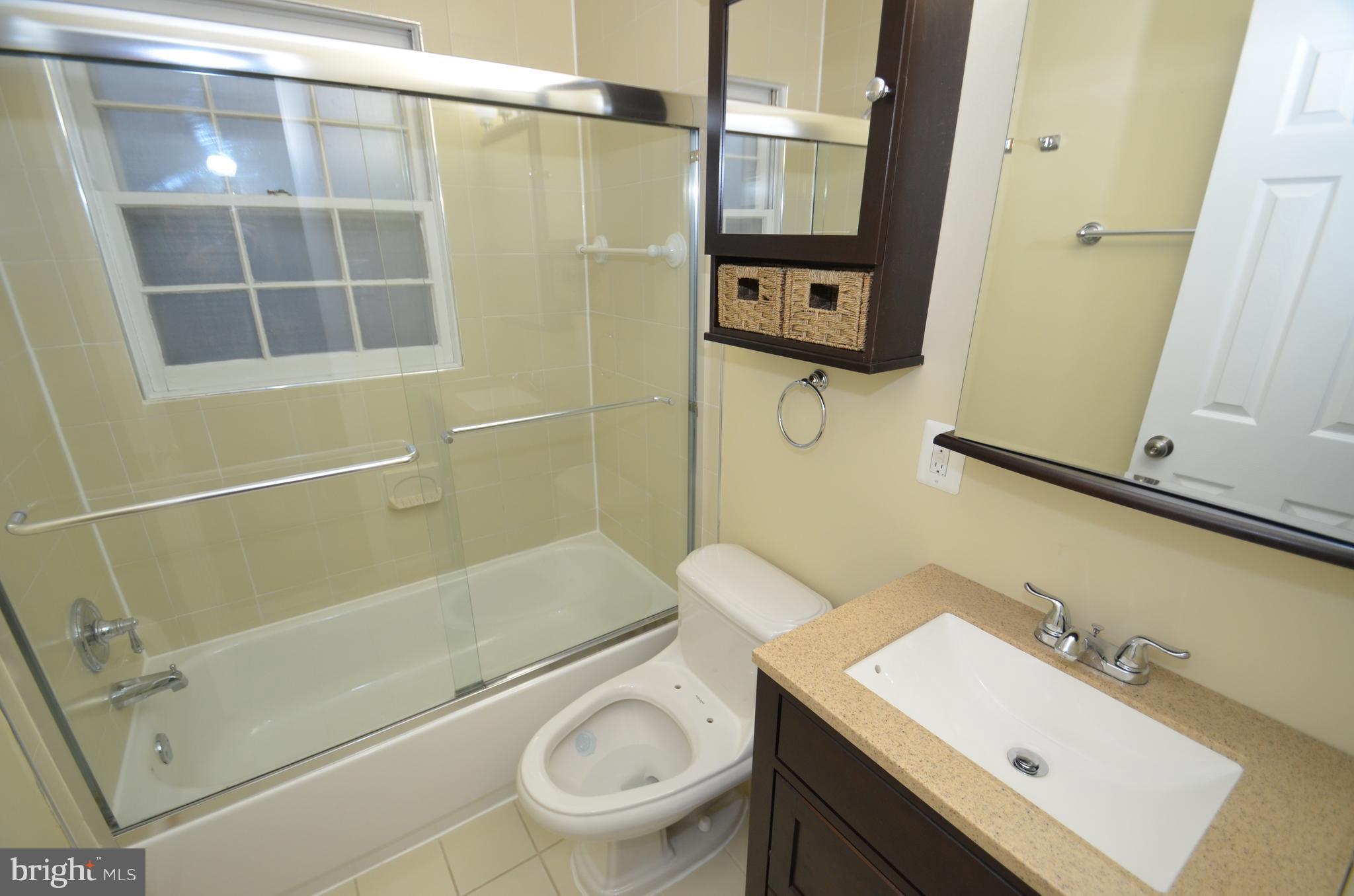 5612 Ashfield Road Alexandria, VA 22315 - Photo 22 of 29 a bathroom with a sink toilet and shower