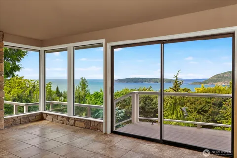 a view of a wooden deck with a yard