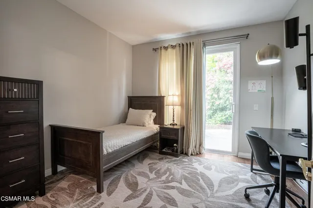 a bedroom with a bed and a table in it