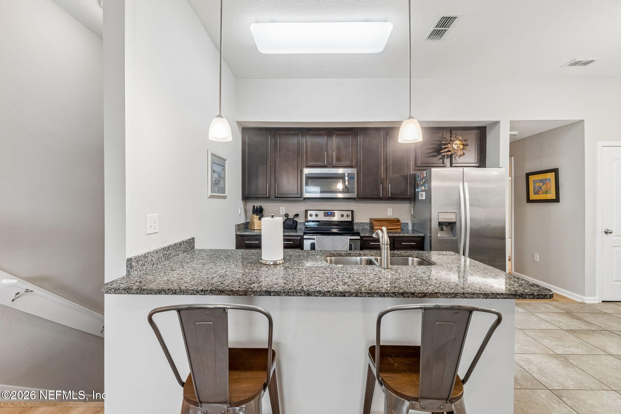 2113 Golden Lake Loop St. Augustine, FL 32084 - Photo 15 of 50 a kitchen with granite countertop a sink cabinets and stainless steel appliances