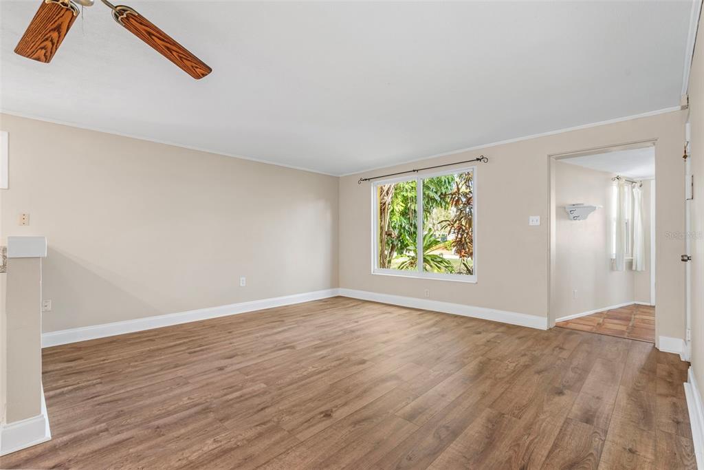 2380 Bay Street Sarasota, FL 34237 - Photo 13 of 48 an empty room with wooden floor and windows