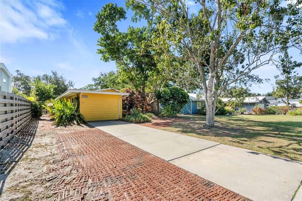2380 Bay Street Sarasota, FL 34237 - Photo 2 of 48 a house with trees in front of it