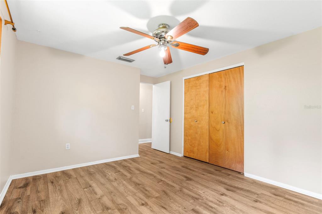 2380 Bay Street Sarasota, FL 34237 - Photo 24 of 48 a view of an empty room with wooden floor