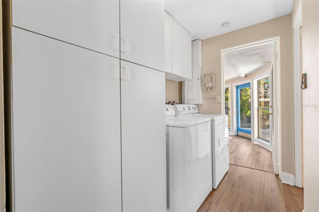 2380 Bay Street Sarasota, FL 34237 - Photo 26 of 48 a utility room with cabinets washer and dryer