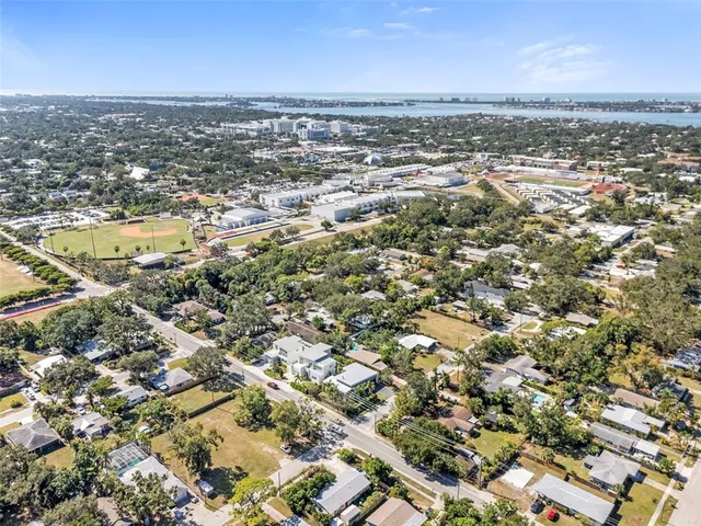 an aerial view of residential building and lake