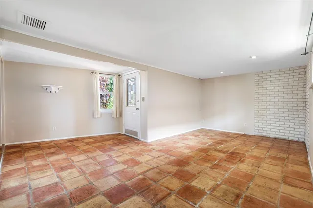 a view of an empty room and window