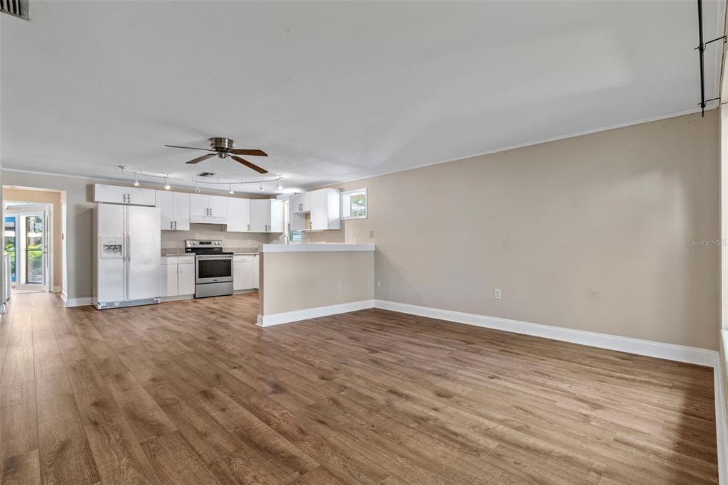 2380 Bay Street Sarasota, FL 34237 - Photo 10 of 48 a view of a kitchen with a sink stove cabinets and empty room