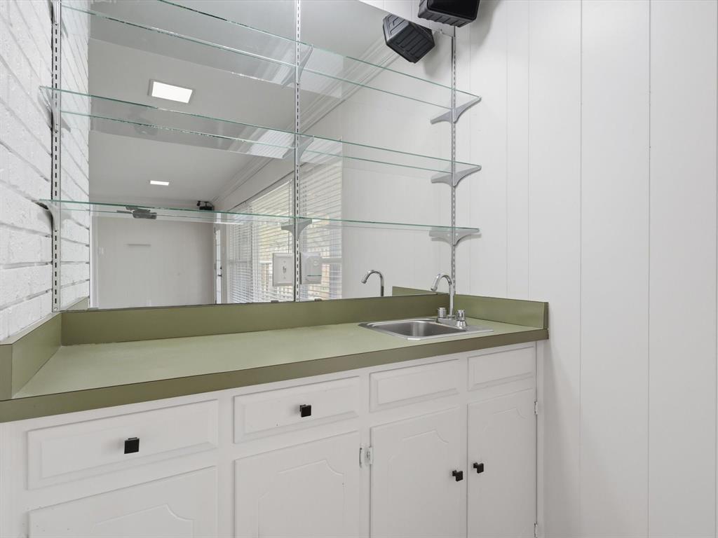 4300 Winding Way Benbrook, TX 76126 - Photo 12 of 24 a kitchen with a sink and cabinets
