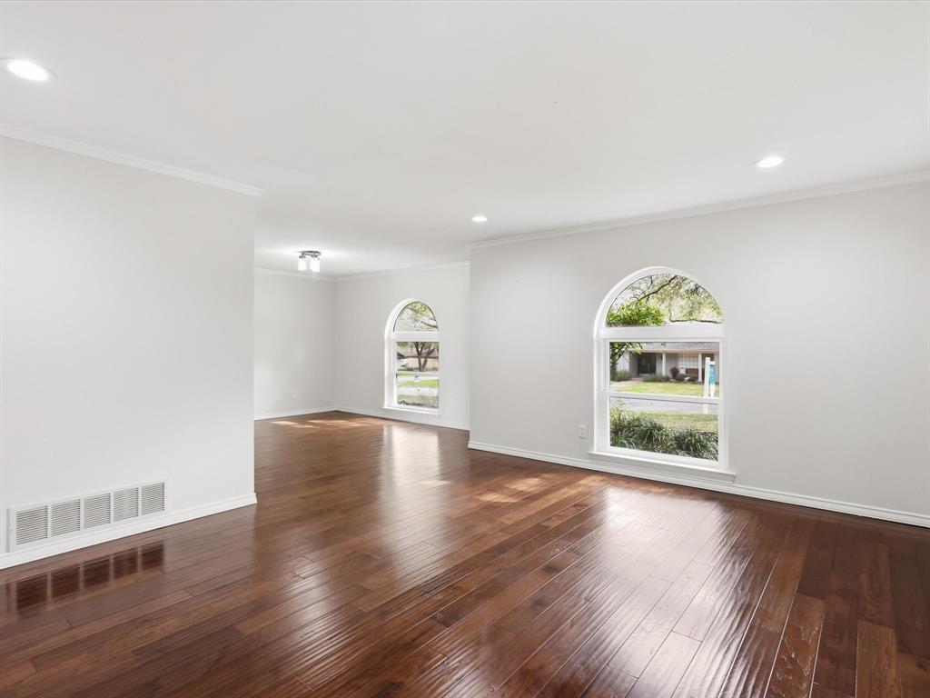 4300 Winding Way Benbrook, TX 76126 - Photo 13 of 24 a view of an empty room with window and wooden floor