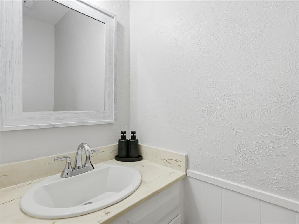 4300 Winding Way Benbrook, TX 76126 - Photo 20 of 24 a bathroom with a sink and a mirror