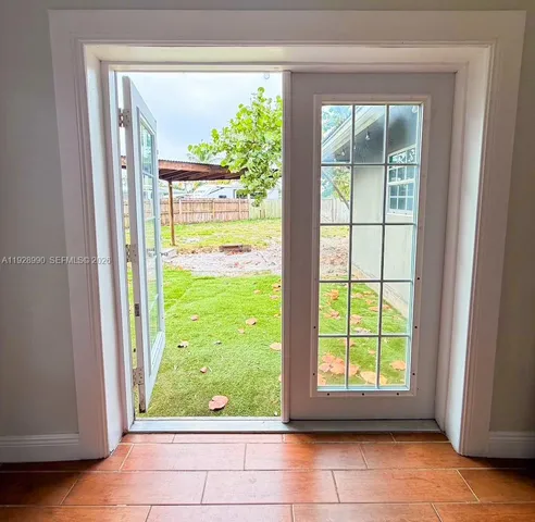 a view of yard with swimming pool and seating space