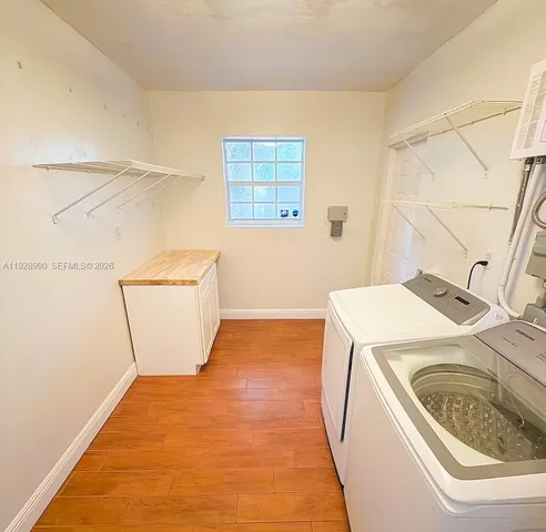 a utility room with dryer and washer