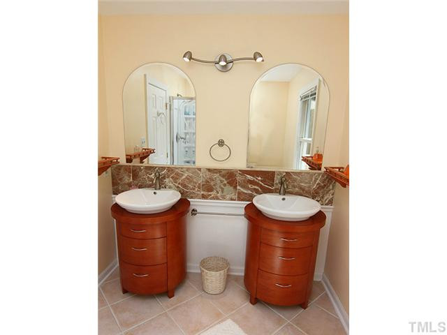 8616 Harbor Drive Raleigh, NC 27615 - Photo 11 of 25 Master Bath with New Double Sink Vanity, New Light Fixture and Mirrors, New Toilet, Marble Backsplash, Large Glass Shower Enclosure. Master Bath/Spa