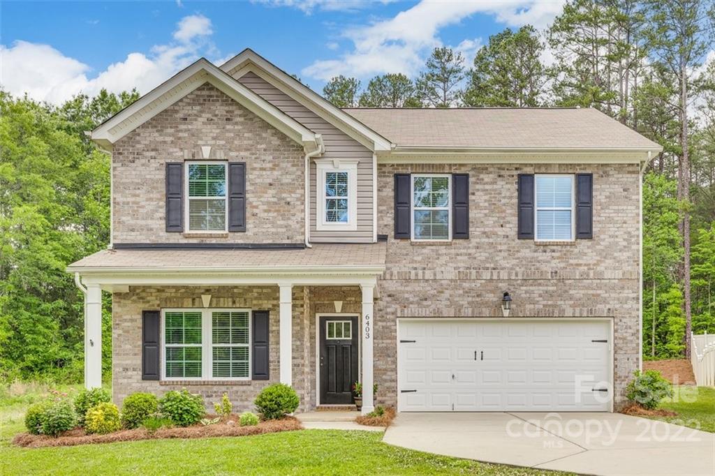 6403 Bluegill Road Charlotte, NC 28216 - Photo 1 of 48 a front view of a house with a yard