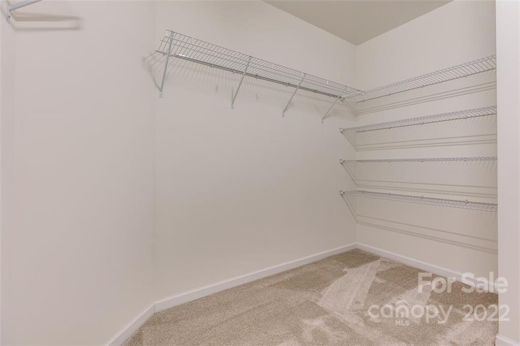 6403 Bluegill Road Charlotte, NC 28216 - Photo 28 of 48 a view of a room with racks on the wall