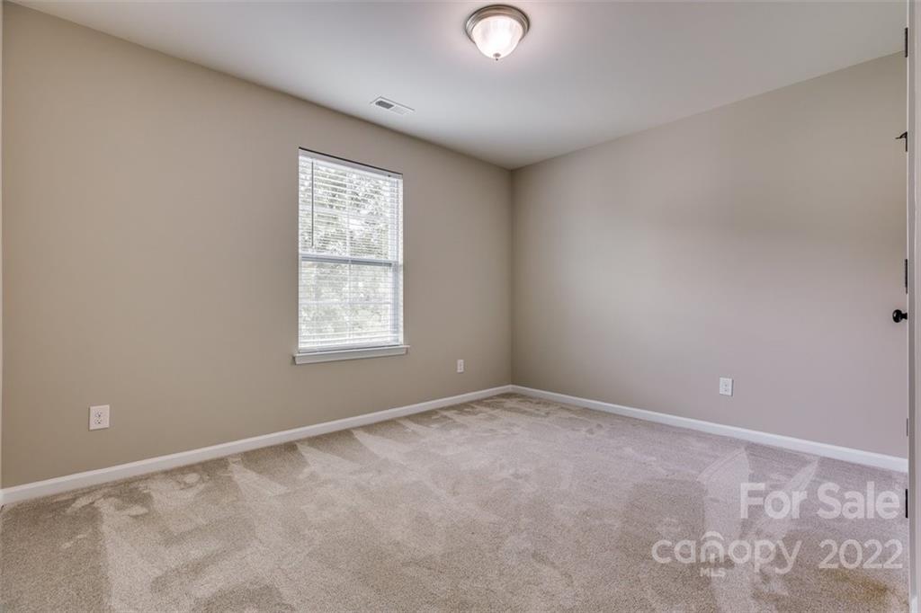 6403 Bluegill Road Charlotte, NC 28216 - Photo 29 of 48 a view of an empty room with a window