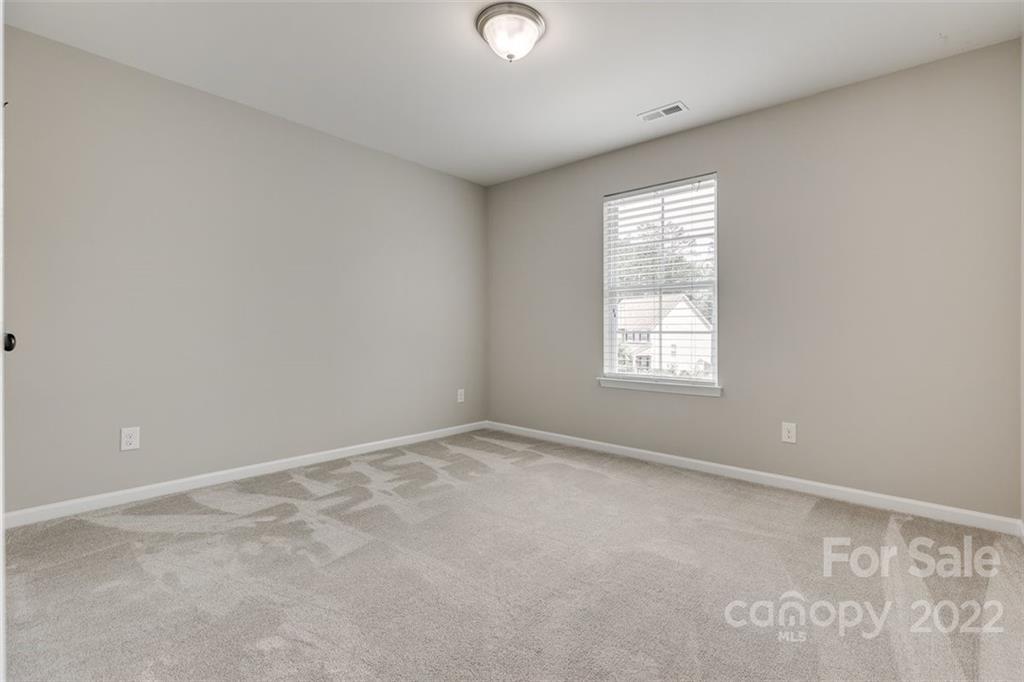 6403 Bluegill Road Charlotte, NC 28216 - Photo 31 of 48 a view of an empty room with a window