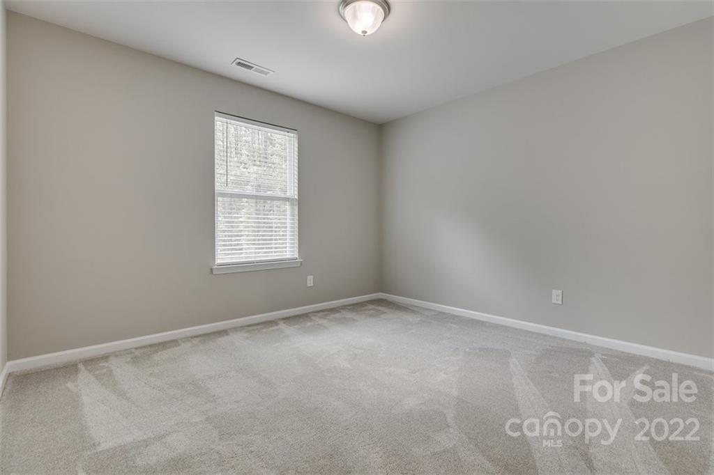 6403 Bluegill Road Charlotte, NC 28216 - Photo 33 of 48 an empty room with windows and closet
