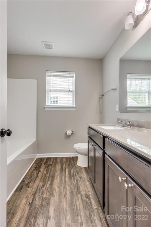 6403 Bluegill Road Charlotte, NC 28216 - Photo 35 of 48 a bathroom with a sink and a toilet