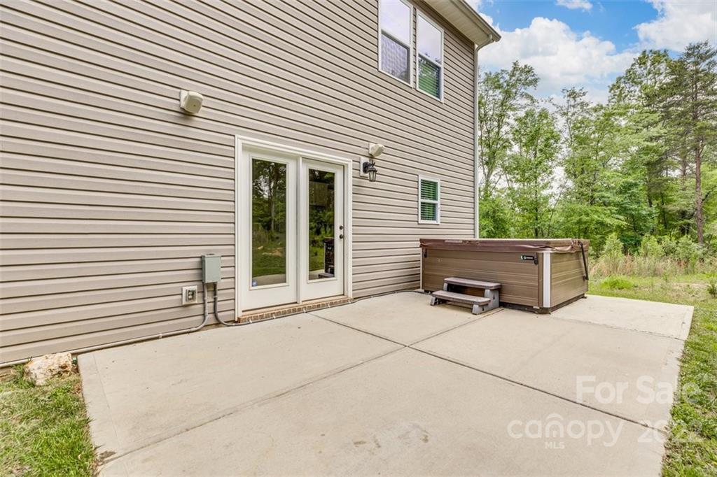 6403 Bluegill Road Charlotte, NC 28216 - Photo 38 of 48 a view of backyard with barbeque grill and wooden fence