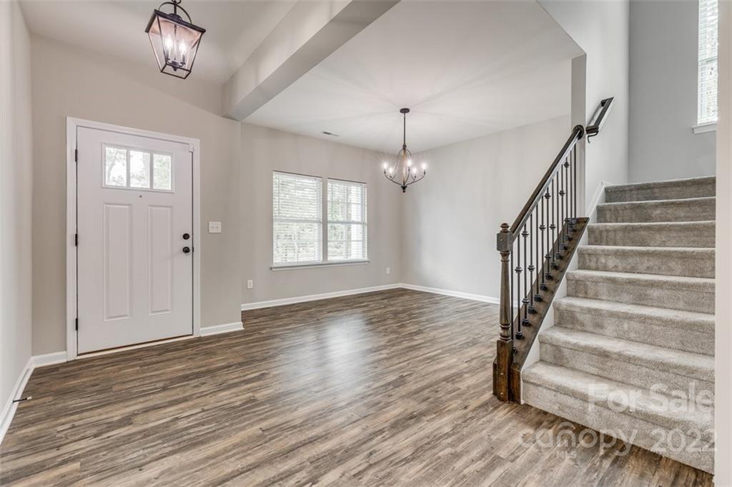 6403 Bluegill Road Charlotte, NC 28216 - Photo 4 of 48 wooden floor in an empty room with a window