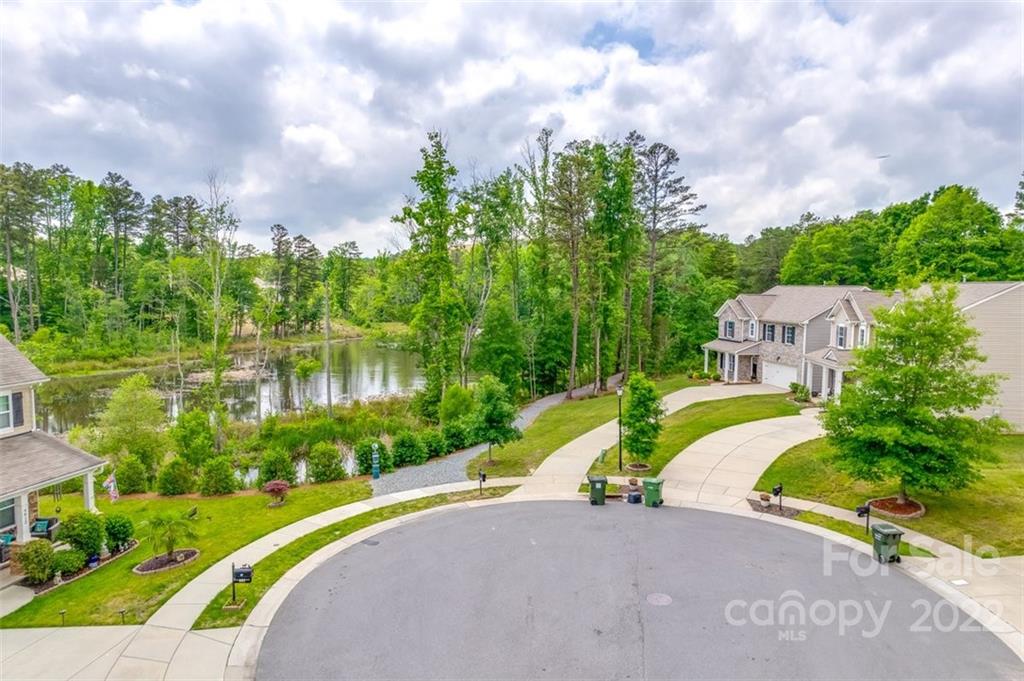 6403 Bluegill Road Charlotte, NC 28216 - Photo 48 of 48 a view of a lake with a house in the background