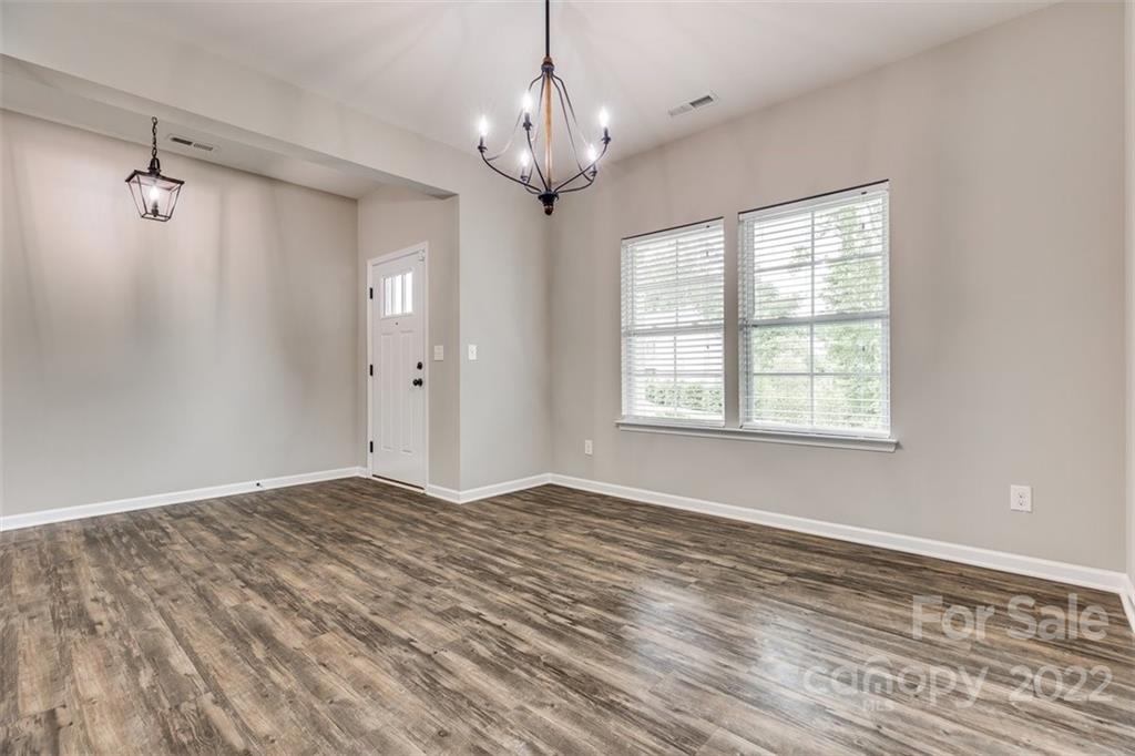 6403 Bluegill Road Charlotte, NC 28216 - Photo 6 of 48 a view of an empty room with a window