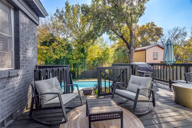 a view of a patio with couple of chairs
